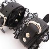 black-lace-leather-bondage-cuffs-rolled-up