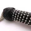 steel-chain-tail-flogger-leather-handle-close-up